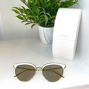 Brand new Prada cat eye white and gold sunglasses .